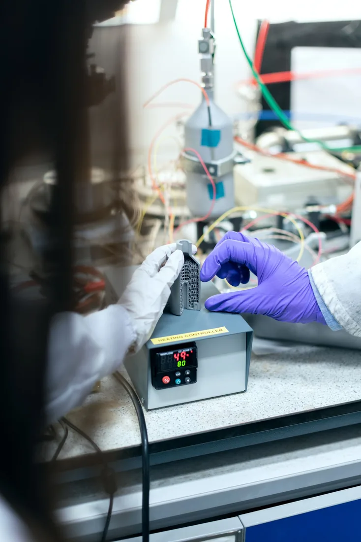 Researcher testing materials in a laboratory