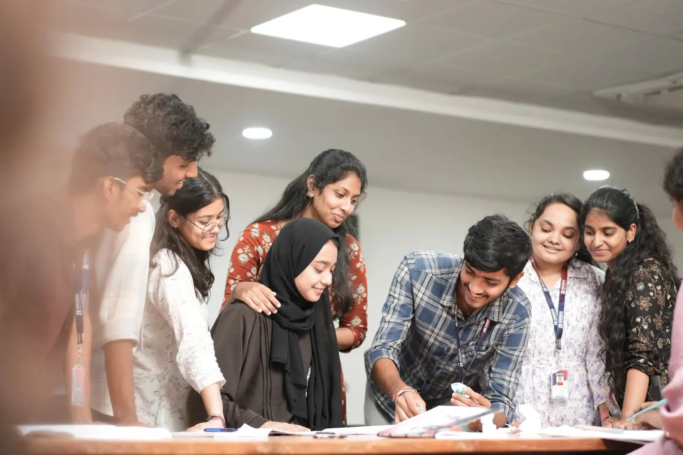 Students working together around a project table