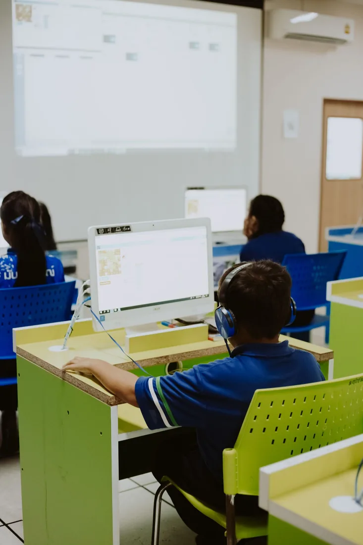 Pupils using computers during a classroom lesson
