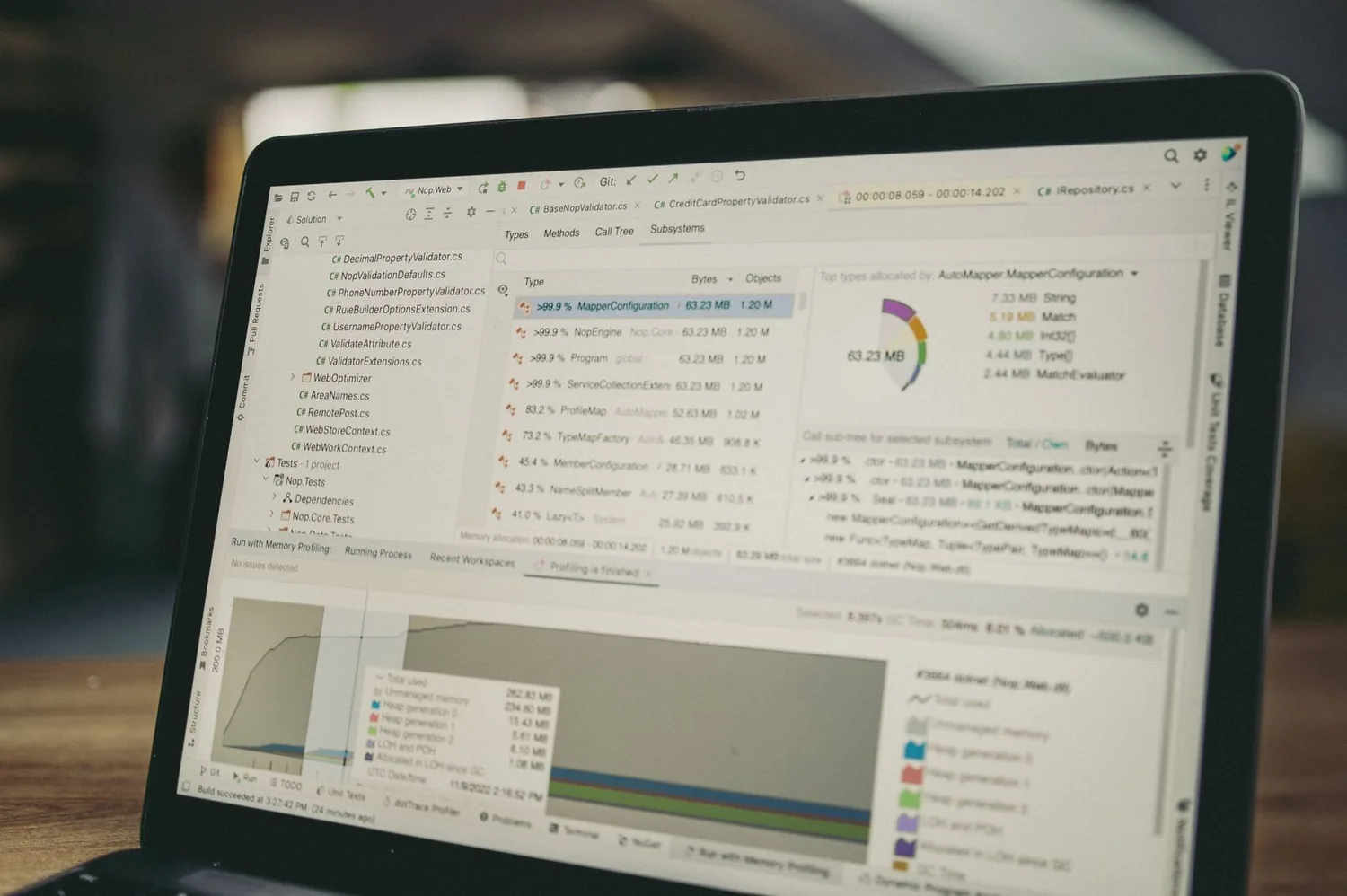 Laptop displaying code and a data analysis workspace