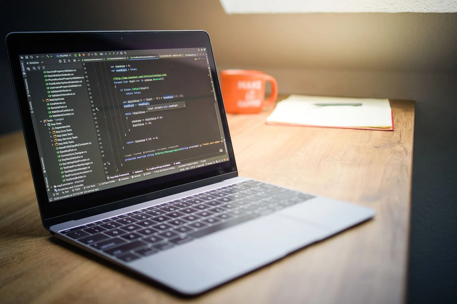 Software workspace with a laptop and project materials