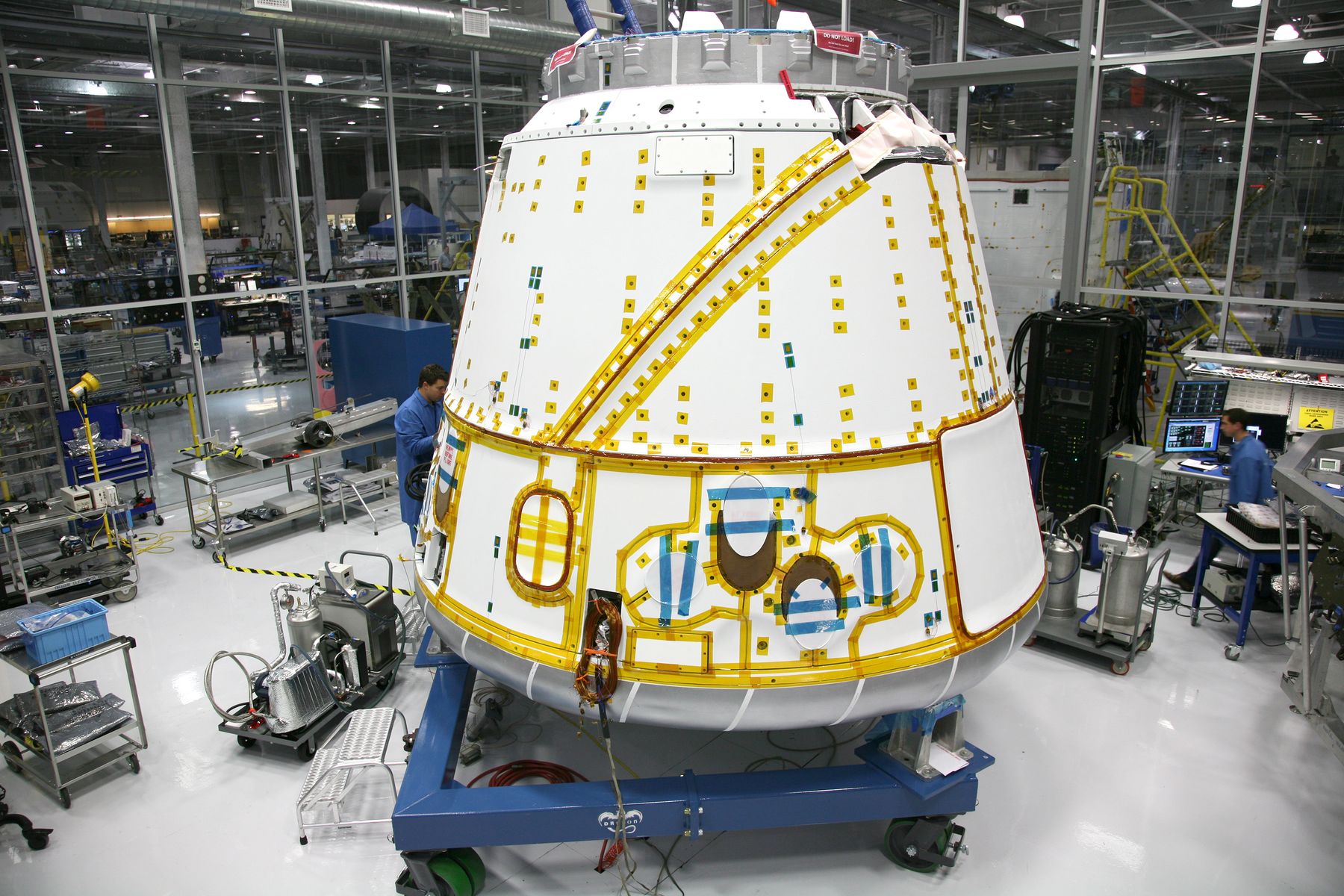 Spacecraft crew module under assembly in an integration facility